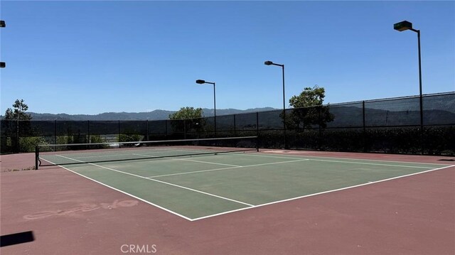 24420 Flaxwood Ln Unit 204, Newhall, CA 91321 - view of tennis court featuring community basketball court and a mountain view