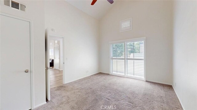 24420 Flaxwood Ln Unit 204, Newhall, CA 91321 - carpeted spare room with ceiling fan, high vaulted ceiling, and baseboards