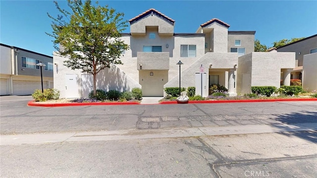 24420 Flaxwood Ln Unit 204, Newhall, CA 91321 - multi unit property with stucco siding and a tiled roof