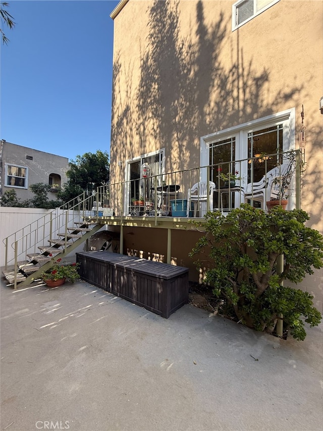 345 Wisconsin Ave Unit 104, Long Beach, CA 90814 - back of property featuring a patio, stucco siding, and stairs