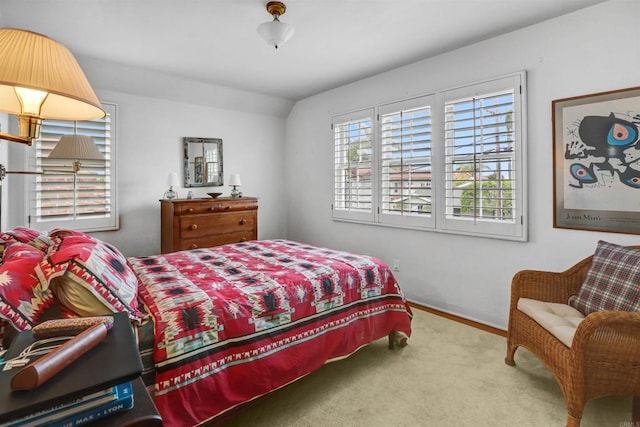 627 Arenas St, La Jolla, CA 92037 - carpeted bedroom featuring vaulted ceiling and baseboards