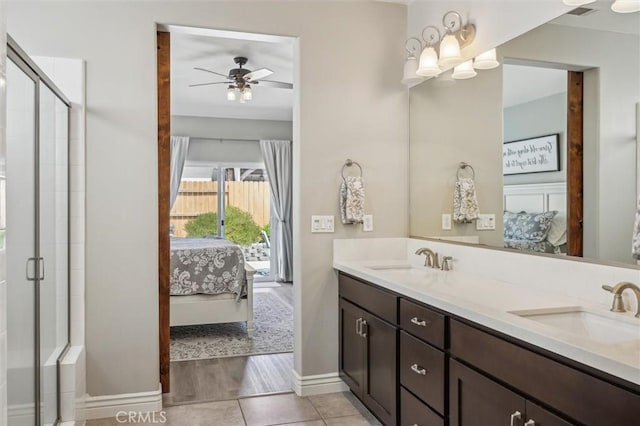 255 Waterfall Rd, Templeton, CA 93465 - ensuite bathroom featuring double vanity, ceiling fan, baseboards, a stall shower, and tile patterned flooring