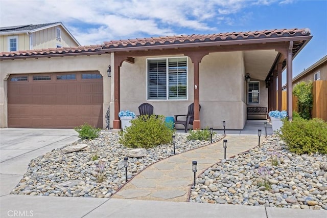 255 Waterfall Rd, Templeton, CA 93465 - mediterranean / spanish-style house with an attached garage, concrete driveway, and stucco siding
