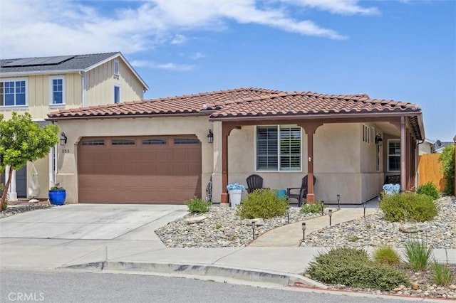 255 Waterfall Rd, Templeton, CA 93465 - mediterranean / spanish-style home with a garage, driveway, stucco siding, and a tiled roof