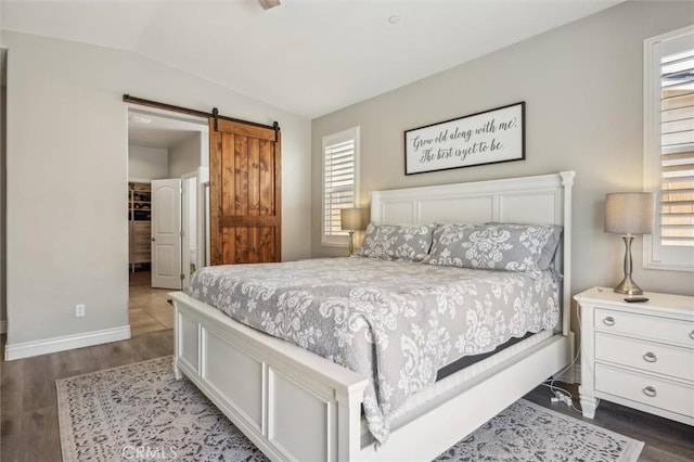 255 Waterfall Rd, Templeton, CA 93465 - bedroom with multiple windows, a barn door, baseboards, lofted ceiling, and dark wood-style floors