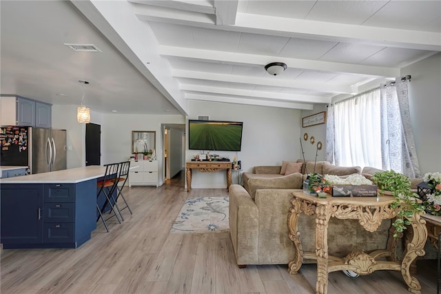 1111 W Berkeley Ct, Ontario, CA 91762 - living room with beam ceiling and light wood finished floors