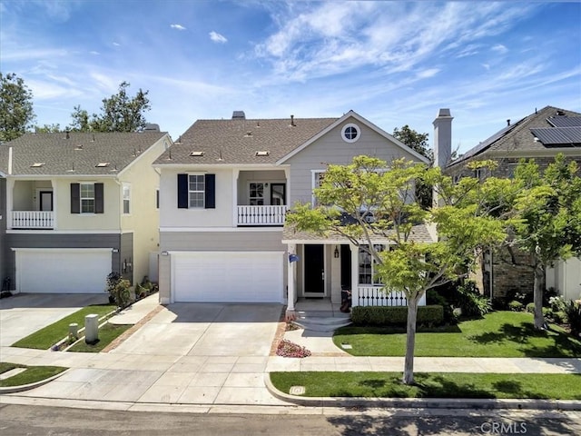 19 Laurelhurst Dr, Ladera Ranch, CA 92694 - traditional-style house with concrete driveway, stucco siding, a garage, a shingled roof, and a front lawn