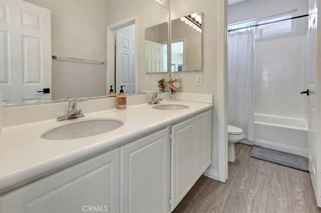 19 Laurelhurst Dr, Ladera Ranch, CA 92694 - full bathroom with toilet, wood finished floors, double vanity, and shower / bath combo