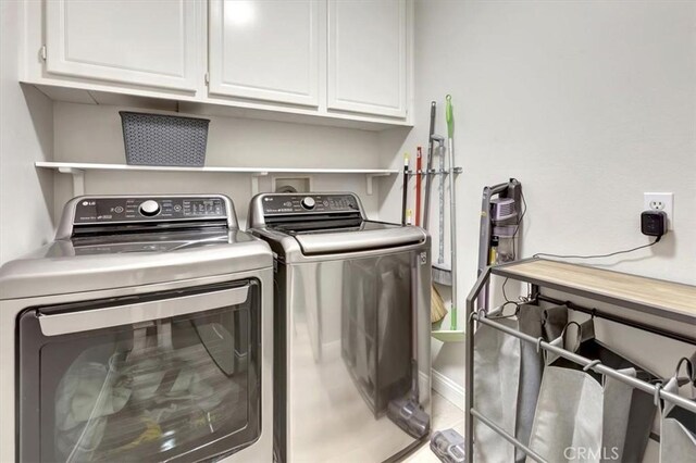 19 Laurelhurst Dr, Ladera Ranch, CA 92694 - washroom with cabinet space, washing machine and clothes dryer, and baseboards