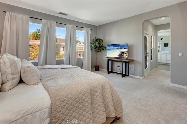 19 Laurelhurst Dr, Ladera Ranch, CA 92694 - bedroom with light carpet, baseboards, and arched walkways