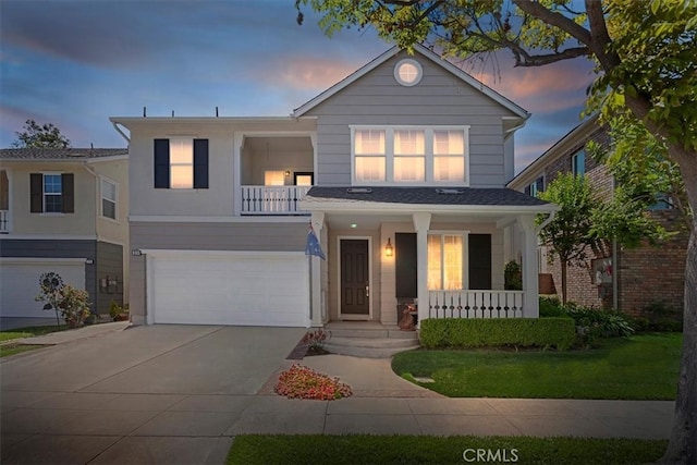 19 Laurelhurst Dr, Ladera Ranch, CA 92694 - traditional-style home with covered porch, a garage, concrete driveway, and a balcony