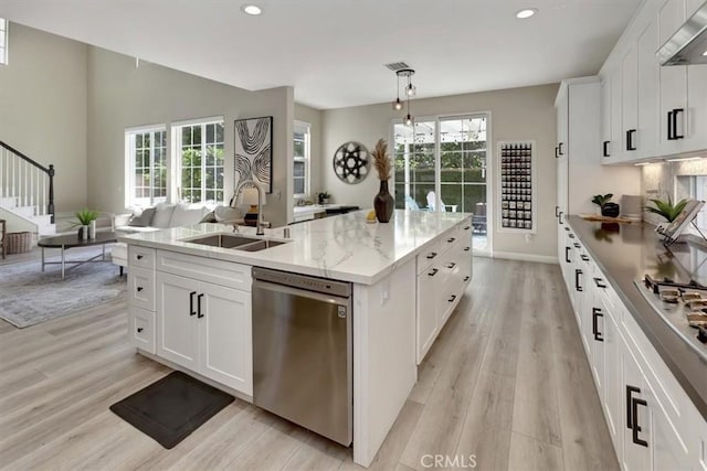 19 Laurelhurst Dr, Ladera Ranch, CA 92694 - kitchen with stainless steel appliances, a sink, a center island with sink, recessed lighting, and under cabinet range hood
