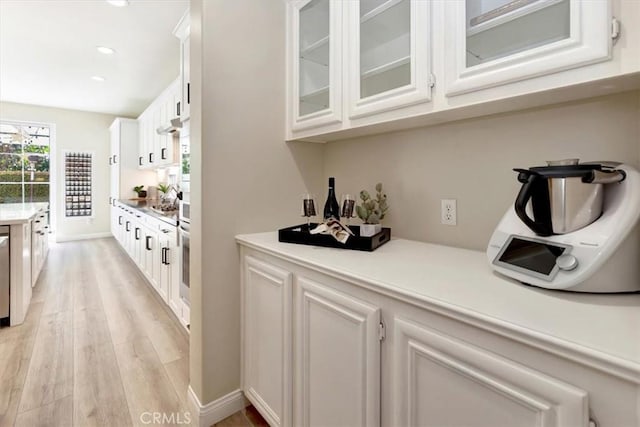 19 Laurelhurst Dr, Ladera Ranch, CA 92694 - bar area featuring light wood-style floors, recessed lighting, and dishwasher