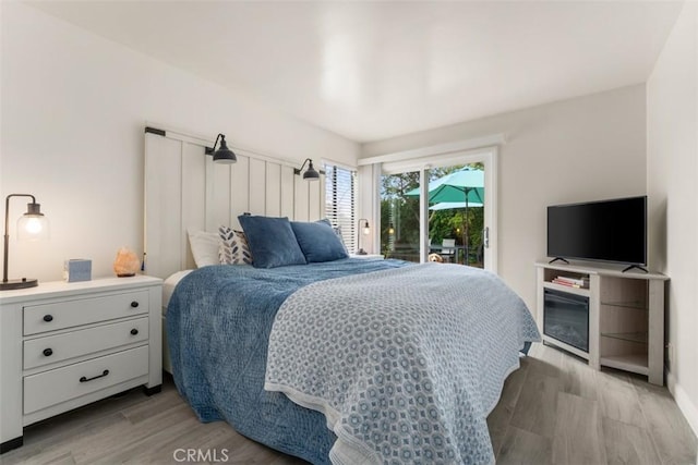 1520 Downs St, Oceanside, CA 92054 - bedroom featuring access to outside and light wood finished floors