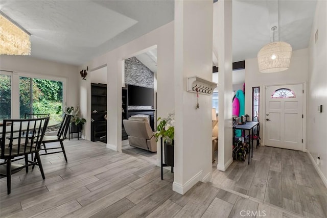 1520 Downs St, Oceanside, CA 92054 - foyer entrance featuring light wood-type flooring, baseboards, and lofted ceiling