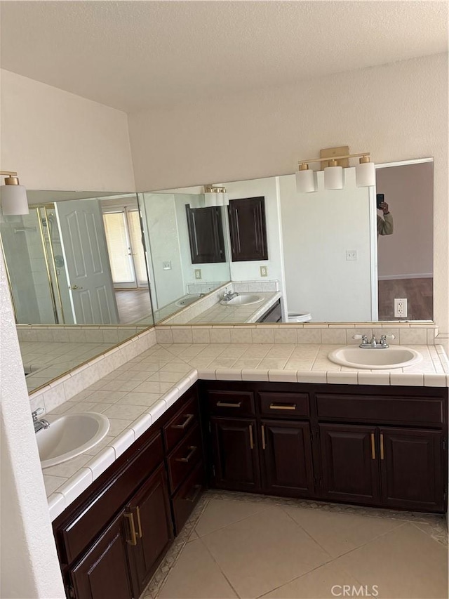 17930 Main St, Hesperia, CA 92345 - full bath with vanity, tile patterned floors, toilet, and a textured ceiling