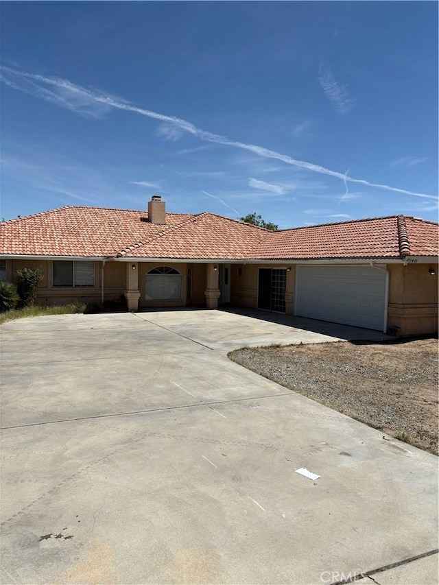 17930 Main St, Hesperia, CA 92345 - single story home with a garage, a chimney, a tiled roof, and driveway