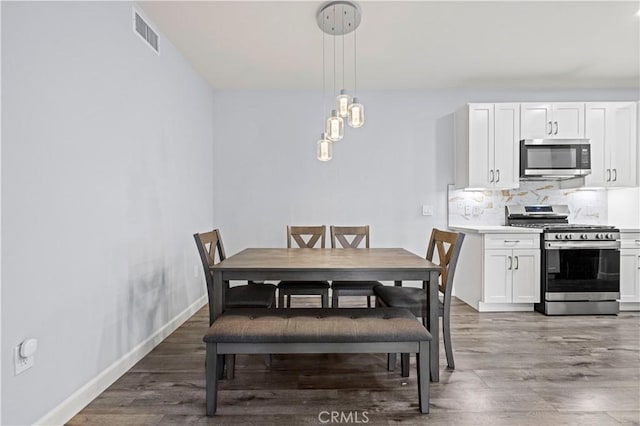 20000 Plum Canyon Rd Unit 1326, Saugus, CA 91350 - dining space with light wood-style flooring and baseboards