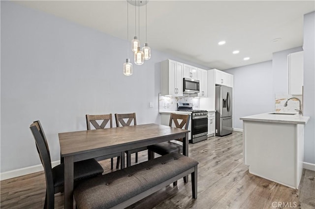20000 Plum Canyon Rd Unit 1326, Saugus, CA 91350 - dining area featuring light wood-style floors, baseboards, and recessed lighting