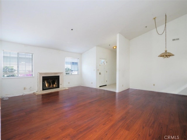 3819 W 190th St, Torrance, CA 90504 - unfurnished living room featuring wood finished floors, a glass covered fireplace, and lofted ceiling