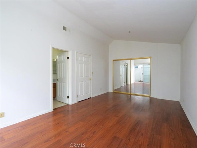 3819 W 190th St, Torrance, CA 90504 - spare room featuring lofted ceiling, wood finished floors, and baseboards
