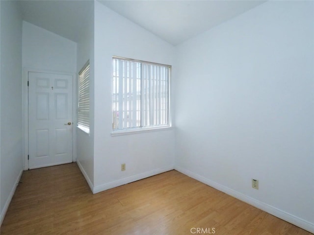 3819 W 190th St, Torrance, CA 90504 - unfurnished room featuring vaulted ceiling, light wood-style floors, and baseboards