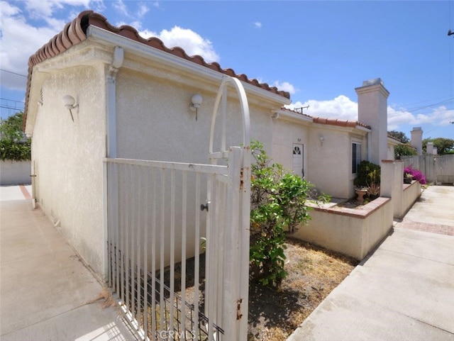 3819 W 190th St, Torrance, CA 90504 - view of side of property featuring a tile roof and stucco siding