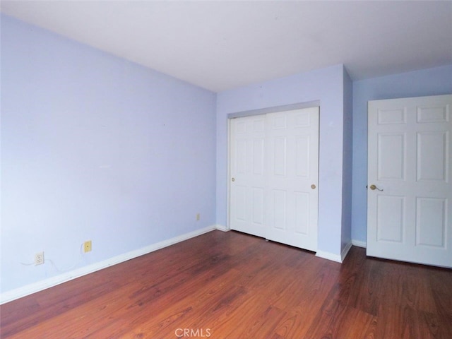 3819 W 190th St, Torrance, CA 90504 - unfurnished bedroom with wood finished floors, baseboards, and a closet