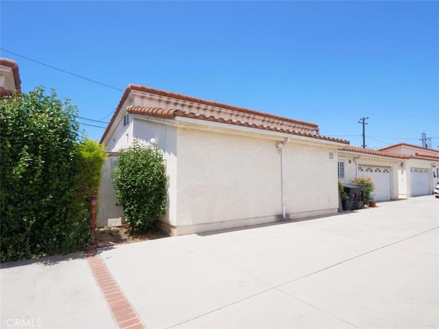 3819 W 190th St, Torrance, CA 90504 - view of front facade with stucco siding, a tiled roof, and an attached garage