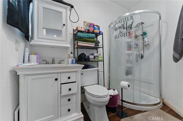 1089 E Columbia Ave, Pomona, CA 91767 - full bathroom with a stall shower, vanity, toilet, wood finished floors, and baseboards