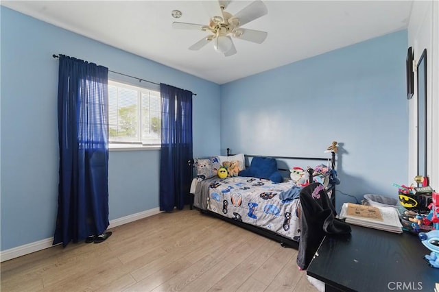 1089 E Columbia Ave, Pomona, CA 91767 - bedroom featuring light wood-style floors, baseboards, and a ceiling fan