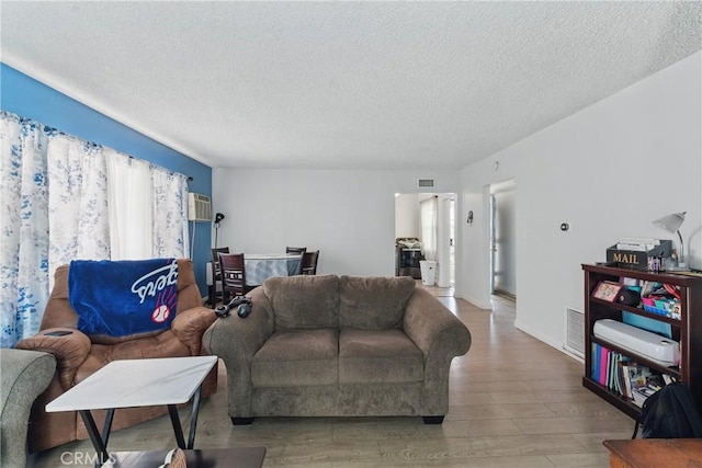 1089 E Columbia Ave, Pomona, CA 91767 - living room featuring a textured ceiling and wood finished floors