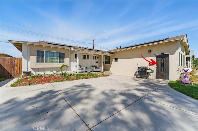1089 E Columbia Ave, Pomona, CA 91767 - ranch-style home featuring roof mounted solar panels, stucco siding, and a patio area