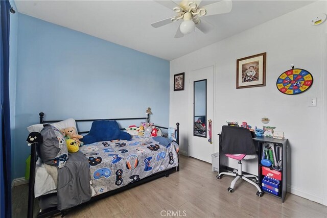 1089 E Columbia Ave, Pomona, CA 91767 - bedroom featuring wood finished floors, baseboards, and ceiling fan