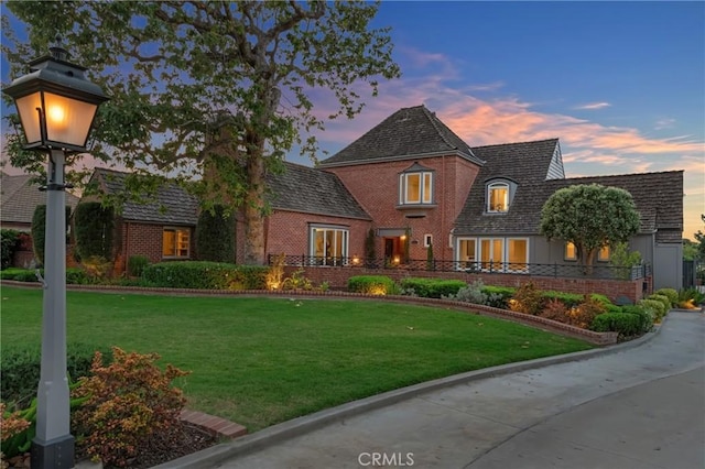 4275 Country Club Dr, Long Beach, CA 90807 - view of front of home featuring brick siding and a lawn