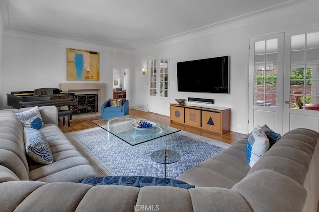 4275 Country Club Dr, Long Beach, CA 90807 - living area featuring wood finished floors, plenty of natural light, ornamental molding, a fireplace, and french doors