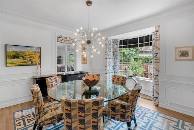 4275 Country Club Dr, Long Beach, CA 90807 - dining area featuring a decorative wall, crown molding, wood finished floors, and a chandelier