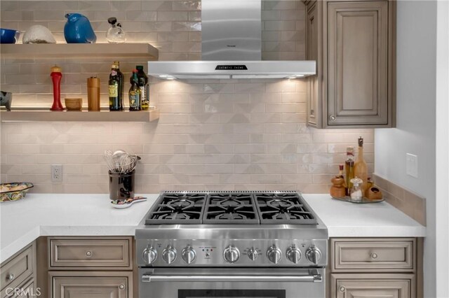 4275 Country Club Dr, Long Beach, CA 90807 - kitchen with stainless steel range, exhaust hood, light countertops, backsplash, and open shelves