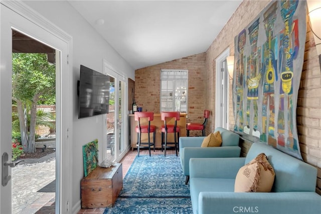 4275 Country Club Dr, Long Beach, CA 90807 - living area with healthy amount of natural light, vaulted ceiling, and brick wall