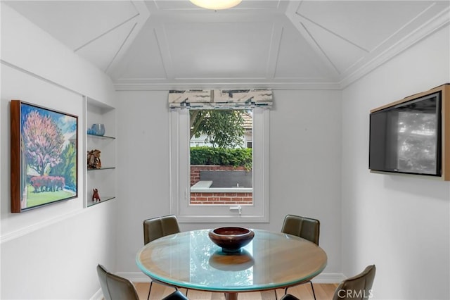 4275 Country Club Dr, Long Beach, CA 90807 - dining room featuring lofted ceiling, built in shelves, and baseboards