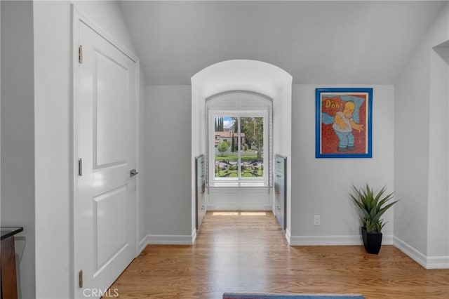 4275 Country Club Dr, Long Beach, CA 90807 - hall with light wood finished floors, lofted ceiling, and baseboards