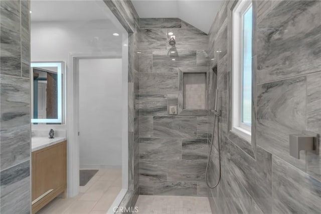 4275 Country Club Dr, Long Beach, CA 90807 - full bath featuring a tile shower, vanity, lofted ceiling, and tile patterned floors