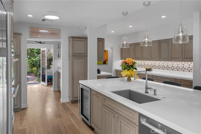 4275 Country Club Dr, Long Beach, CA 90807 - kitchen with a sink, beverage cooler, stainless steel dishwasher, light wood-type flooring, and light countertops