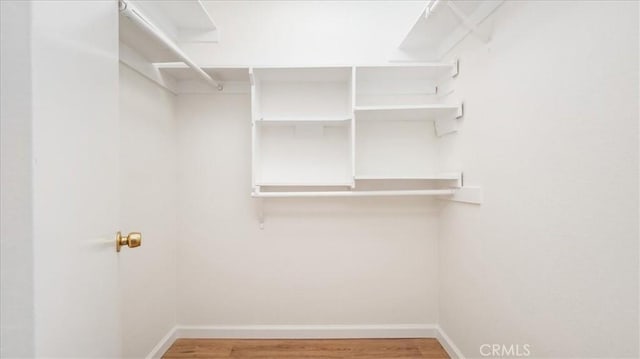 1589 Palomino Ave, Upland, CA 91786 - walk in closet featuring wood finished floors