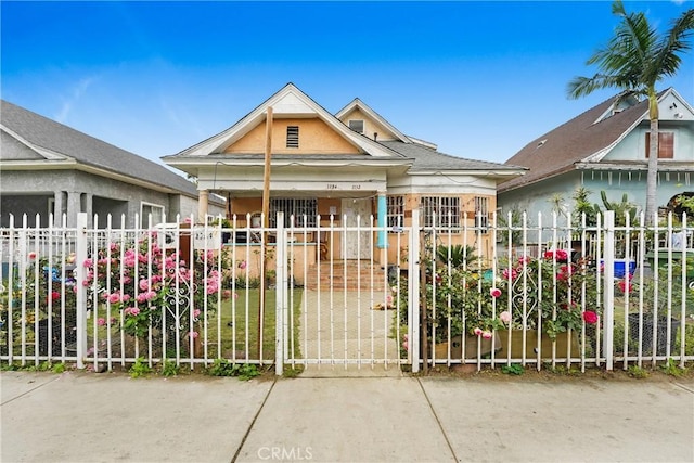 1132 E 53rd St, Los Angeles, CA 90011 - view of front facade featuring a gate and a porch