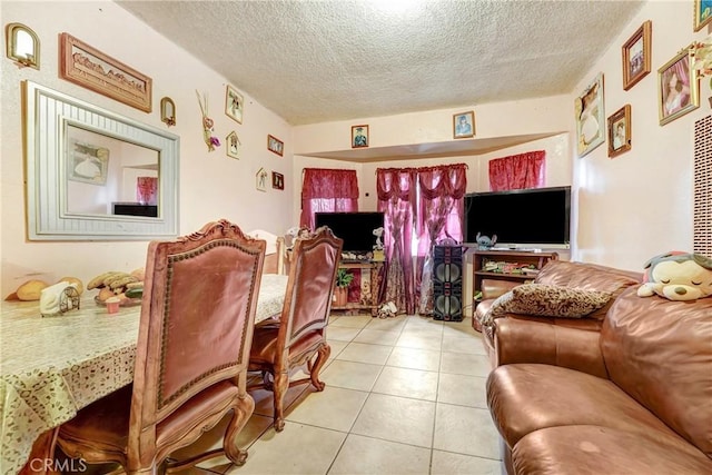 1132 E 53rd St, Los Angeles, CA 90011 - living room featuring a textured ceiling and light tile patterned floors