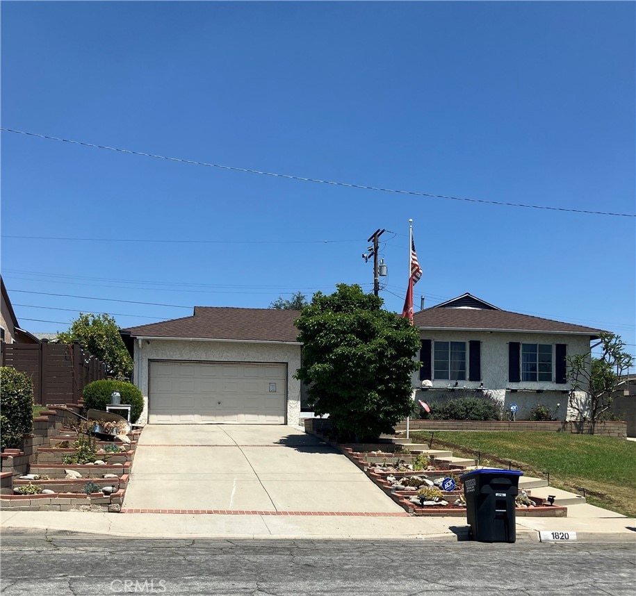 1820 Brockwell Ave, Monterey Park, CA 91754 - single story home featuring driveway, an attached garage, and stucco siding