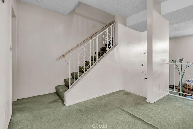5348 Fairview Blvd Unit 3, Ladera Heights, CA 90056 - stairs with carpet, a textured ceiling, and baseboards