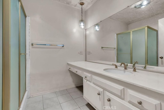5348 Fairview Blvd Unit 3, Ladera Heights, CA 90056 - bathroom featuring vanity, tile patterned floors, a shower with door, and baseboards