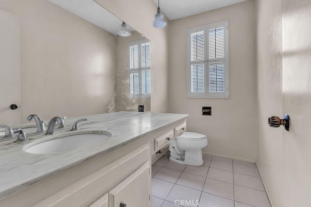 5348 Fairview Blvd Unit 3, Ladera Heights, CA 90056 - bathroom featuring tile patterned flooring, vanity, toilet, and baseboards